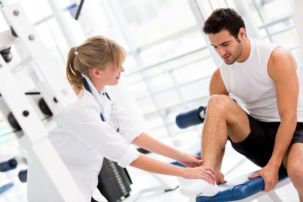 Male-getting-ankle-examined-1024x682